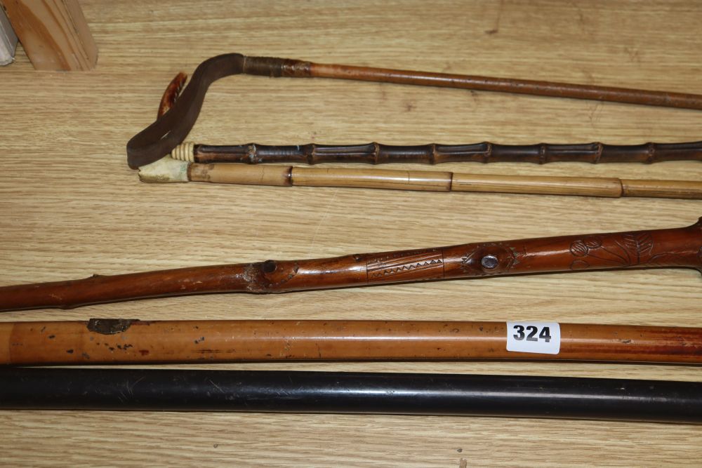 A European bone inlaid crossbow, two walking canes and three riding crops